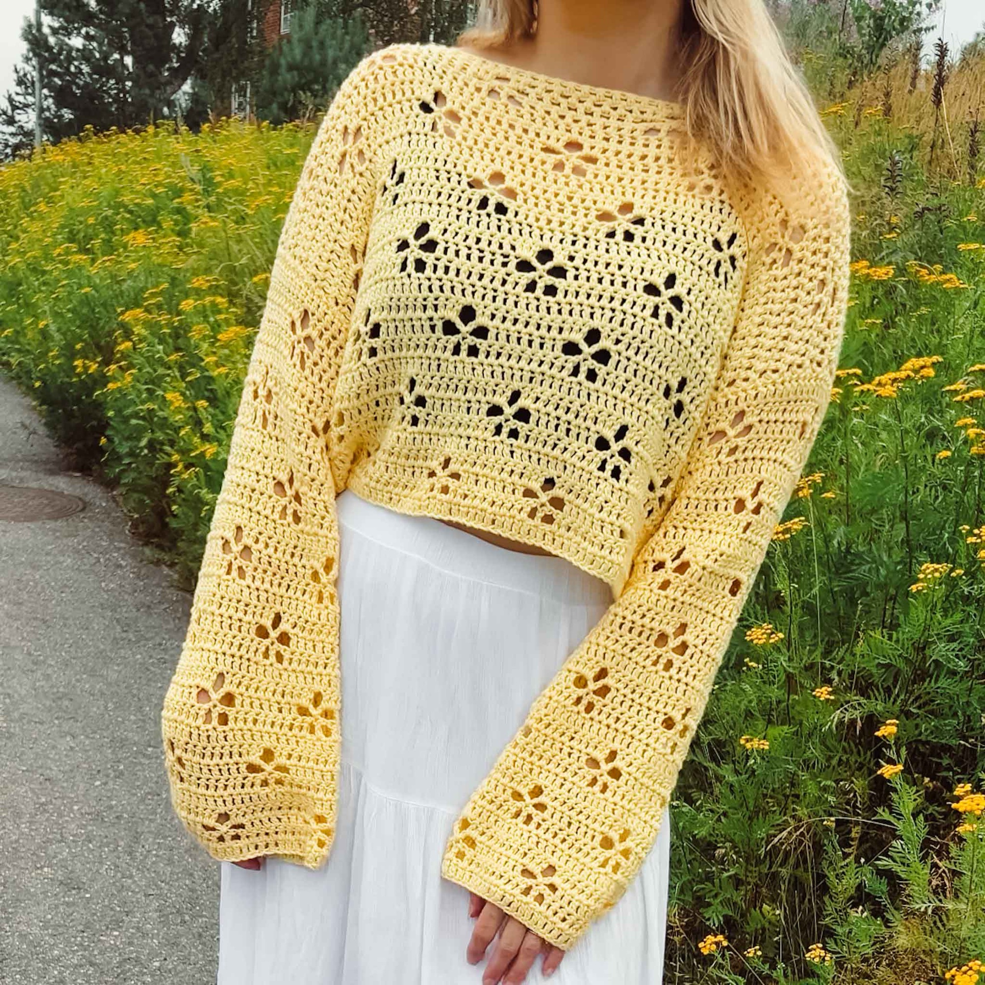 Yellow crochet sweater with flowers